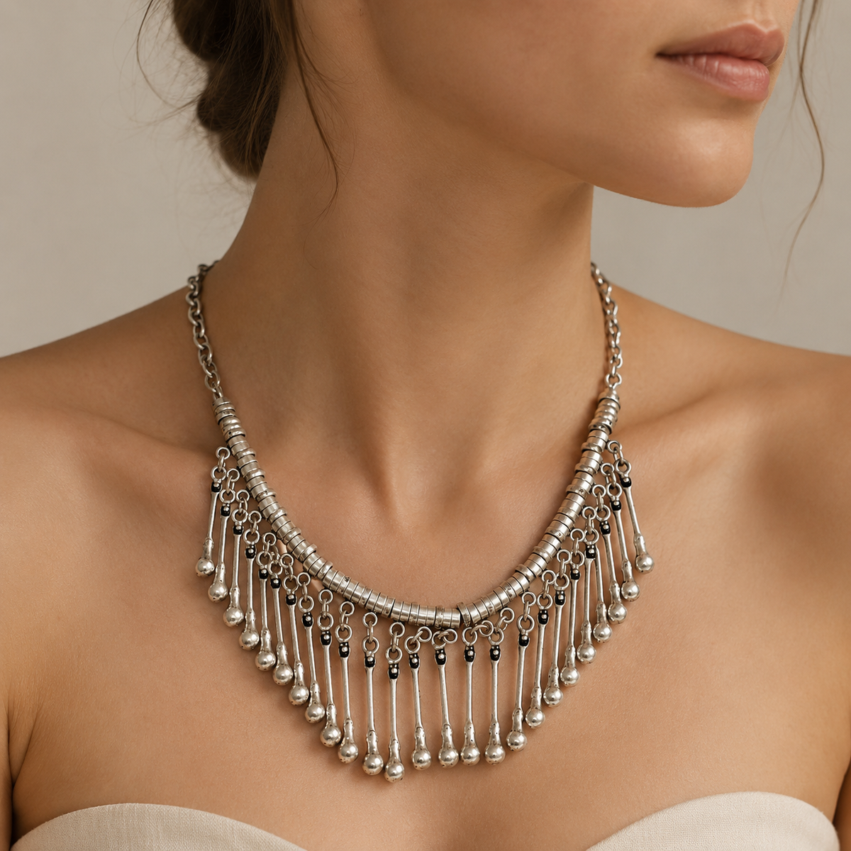 Silver-tone fringe collar necklace shown from the front on a white background.