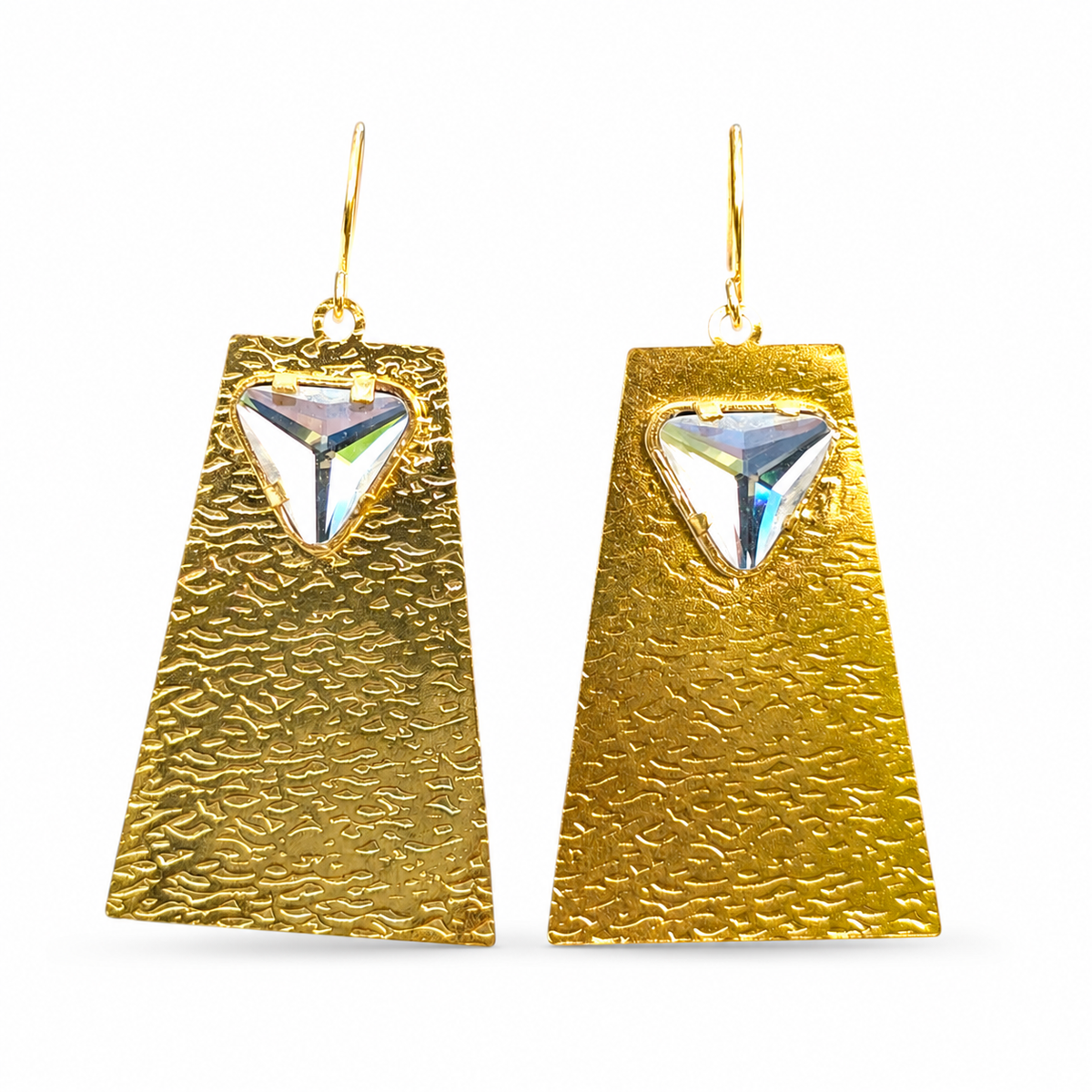 Gold geometric drop earrings with a clear crystal accent and textured surface.