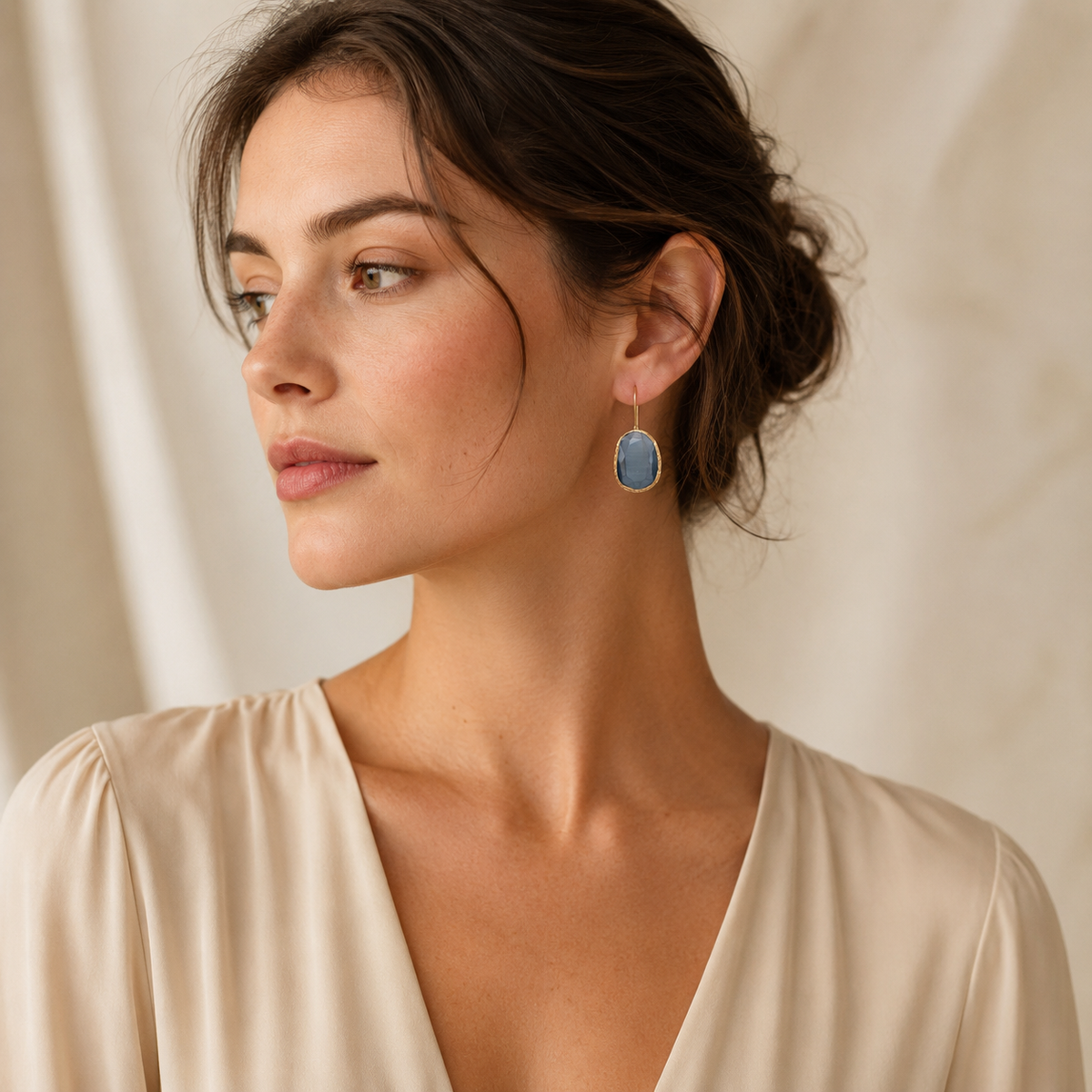 Gray stone drop earrings with a gold-plated finish.
