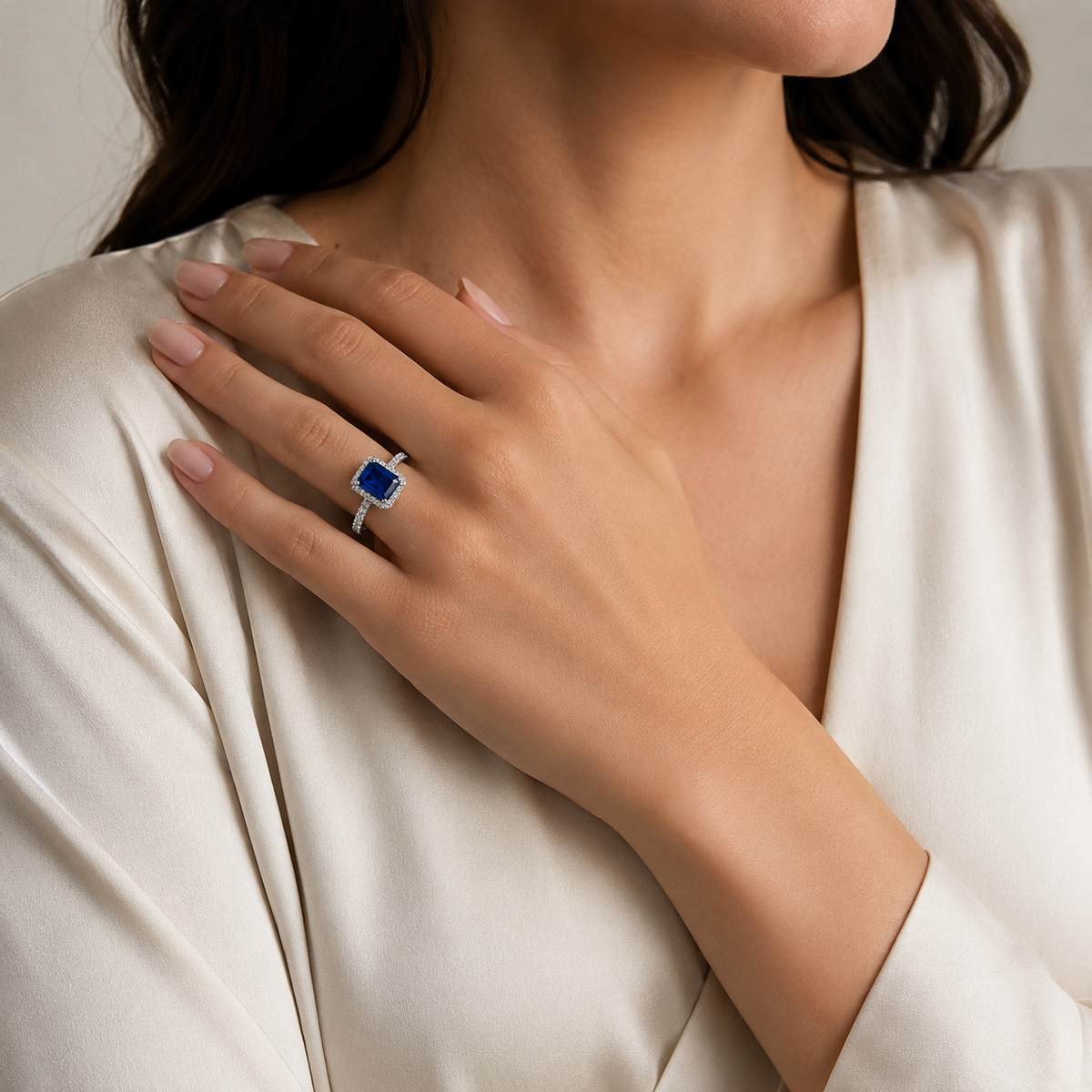 Cushion cut blue sapphire ring with a refined, sparkling silhouette.