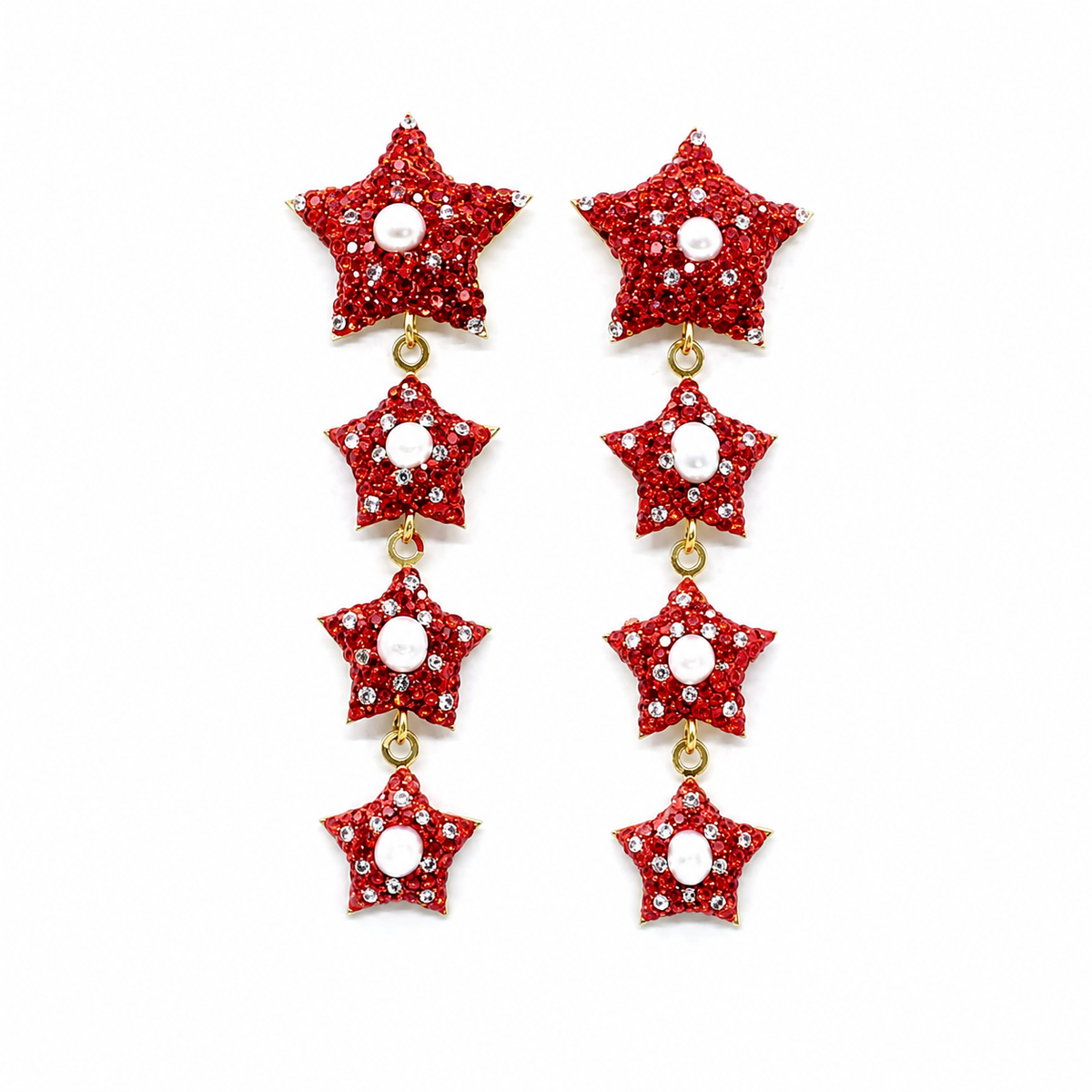 Red star dangle earrings with pearl-like centers and CZ accents on a white background.