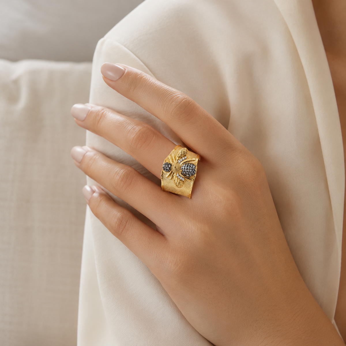 Gold-plated bumble bee ring with sparkling accents and a wide band shape.