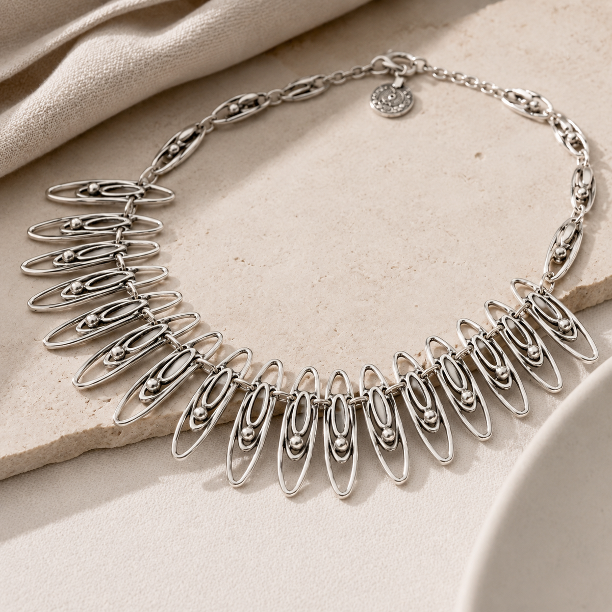Angled view of the oval link statement necklace.