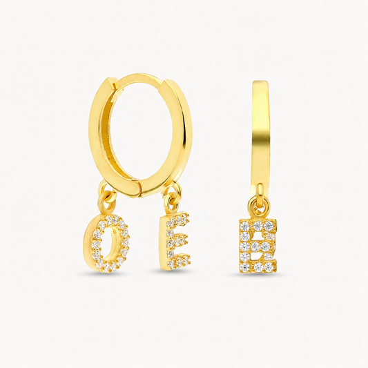 Gold-tone hoop earrings with two CZ initial charms.