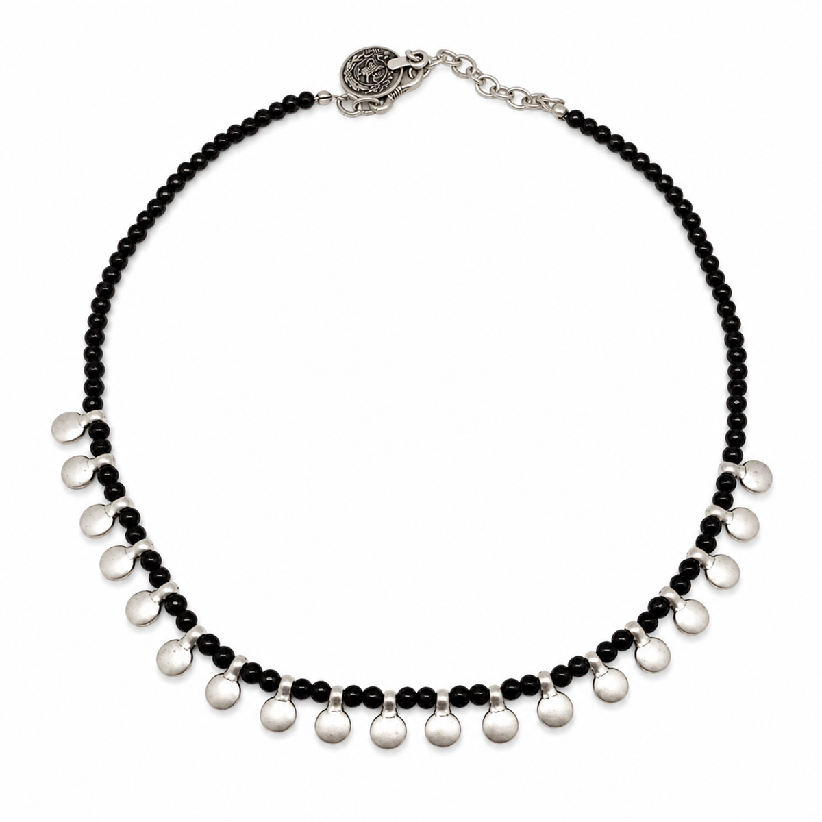 Black bead necklace with silver disc accents on a white background.