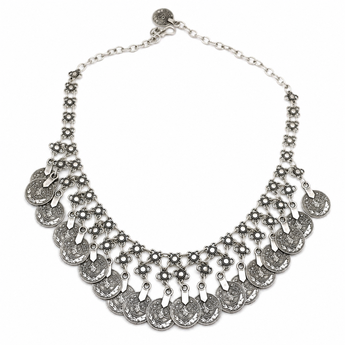Silver-tone floral coin fringe bib necklace with layered engraved charms.