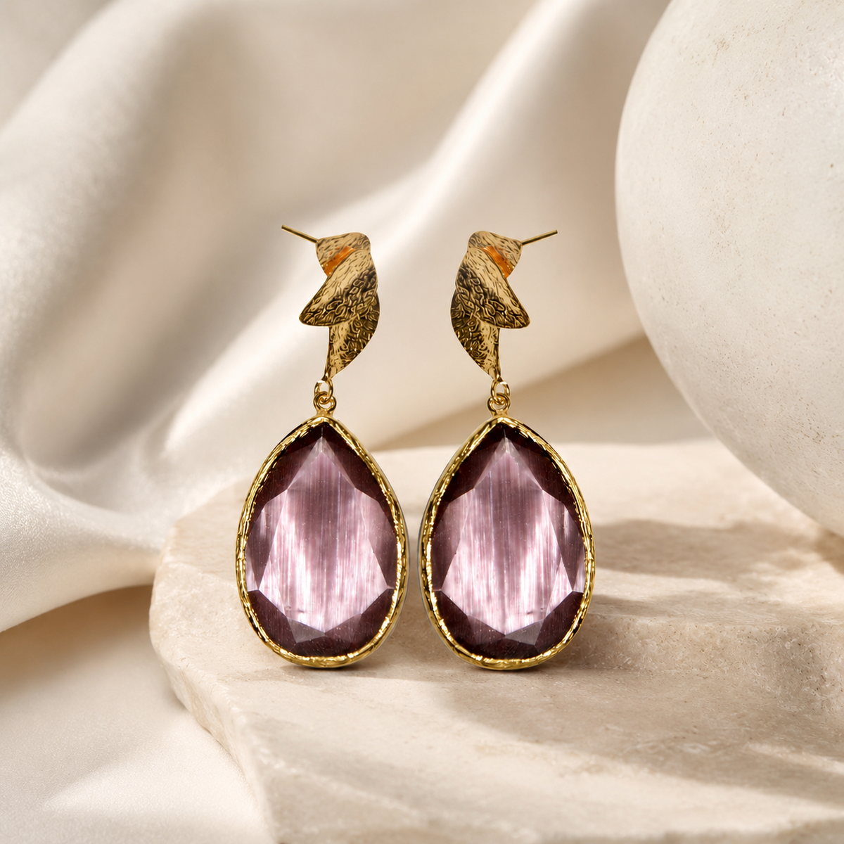 Purple tulip-inspired drop earrings with a gold-plated finish and faceted teardrop shape.