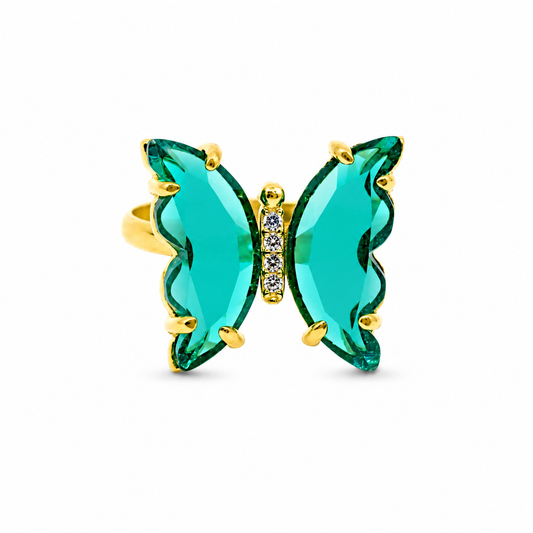 Butterfly ring with crystal-green wings and a gold-tone setting.