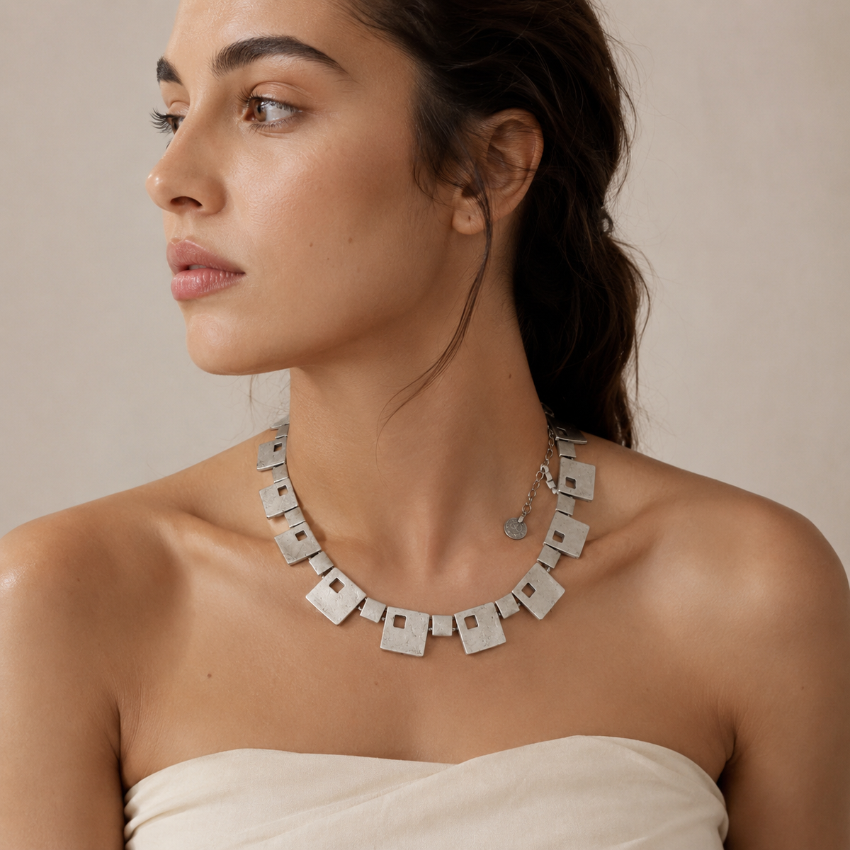 Statement necklace with square links and a silver-tone finish.