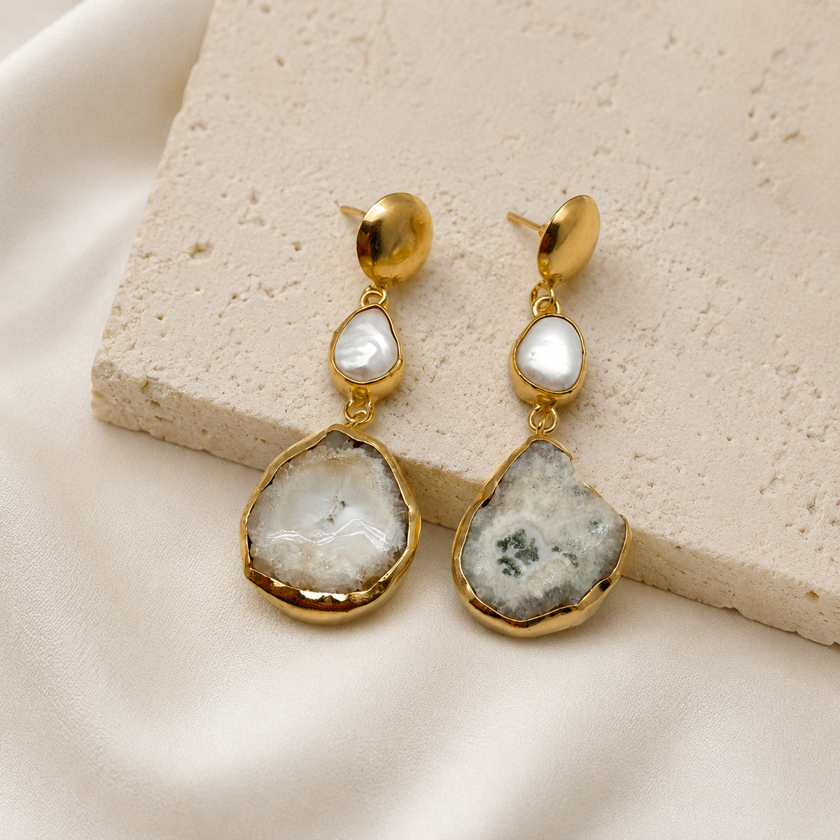 Gold-plated baroque pearl-inspired drop earrings with a softly organic shape.