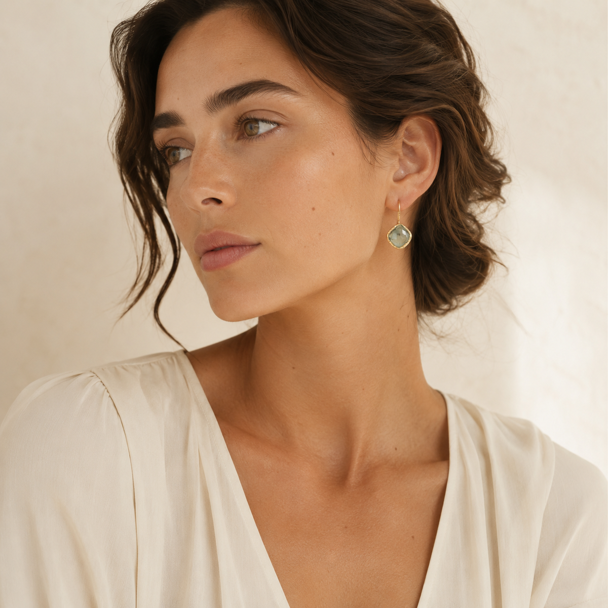 Pair of green aventurine drop earrings with a warm gold-plated frame.