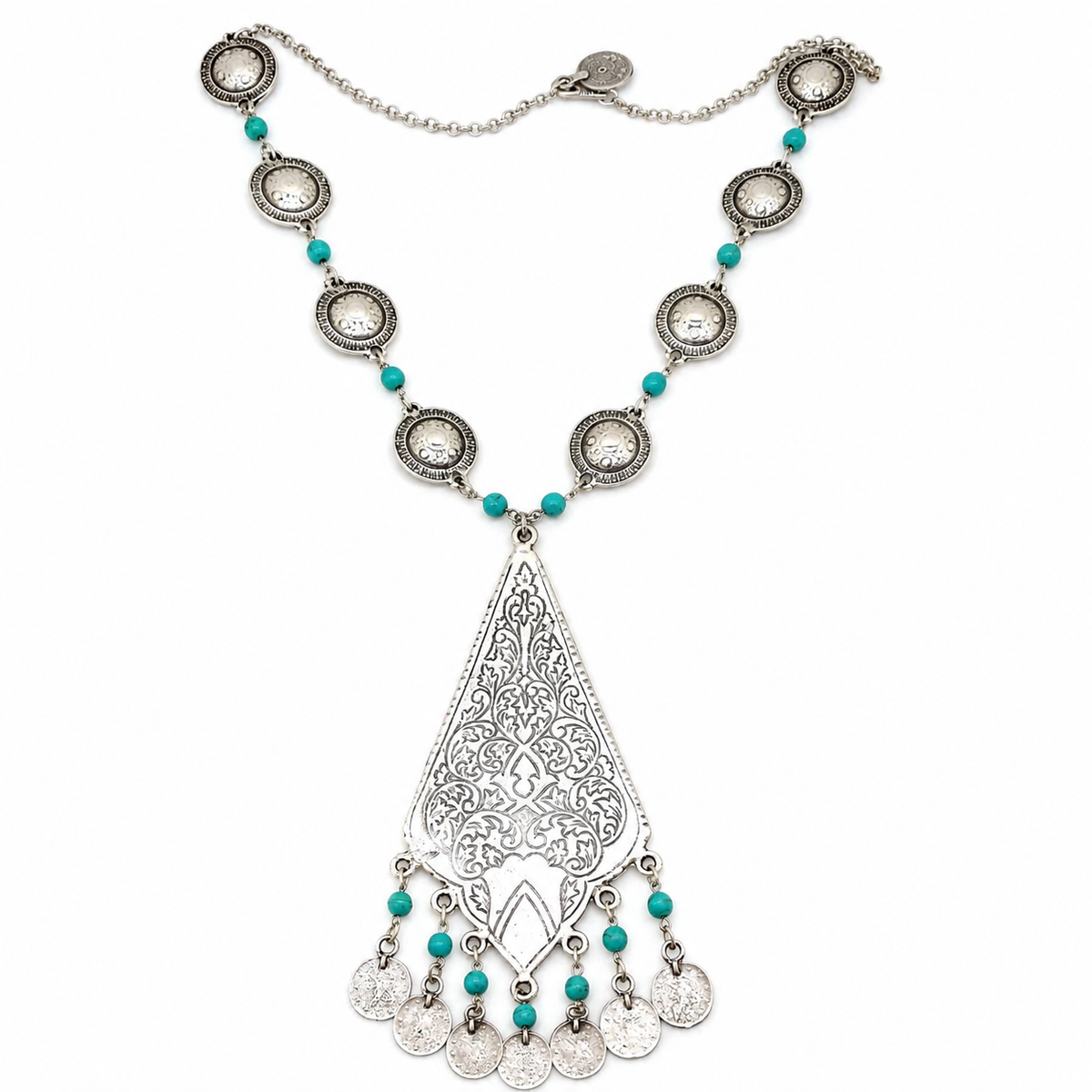 A silver-tone necklace with turquoise beads and an ornate teardrop pendant on a white background.