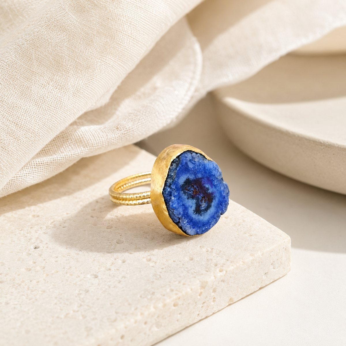 Blue druzy agate ring styled on a clean white background.