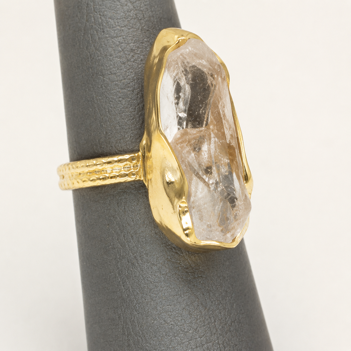 Close view of the raw clear quartz and gold-plated details.