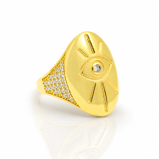 Gold-tone evil eye signet ring with a polished finish and crystal-like accent.