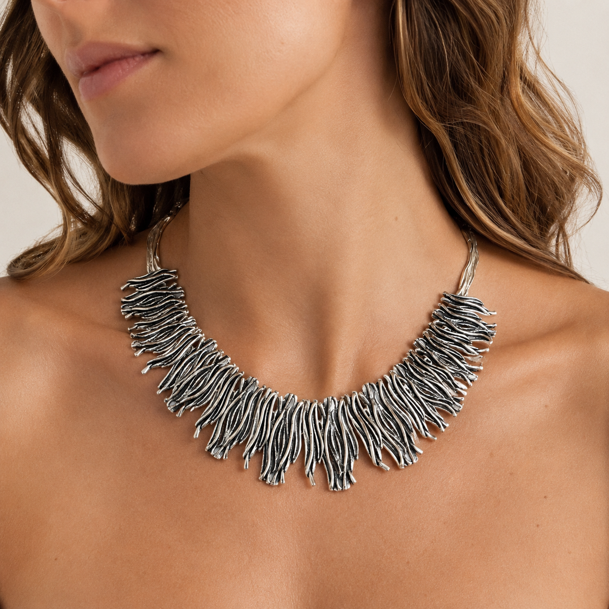 Silver-tone organic fringe collar necklace shown from the front.