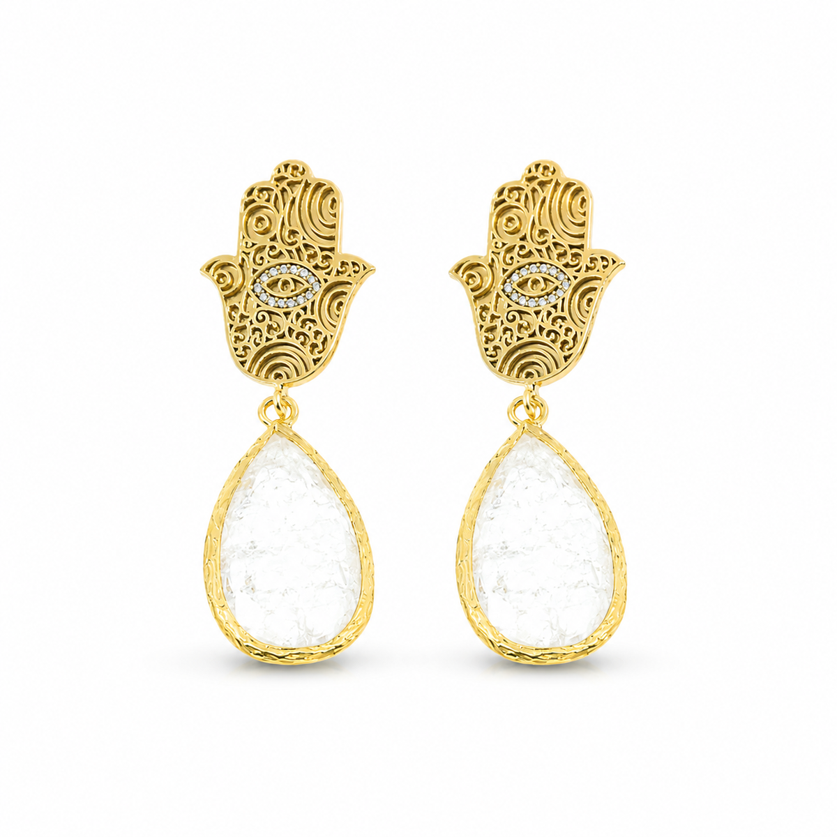 Pair of gold hamsa hand earrings with white teardrop stones.