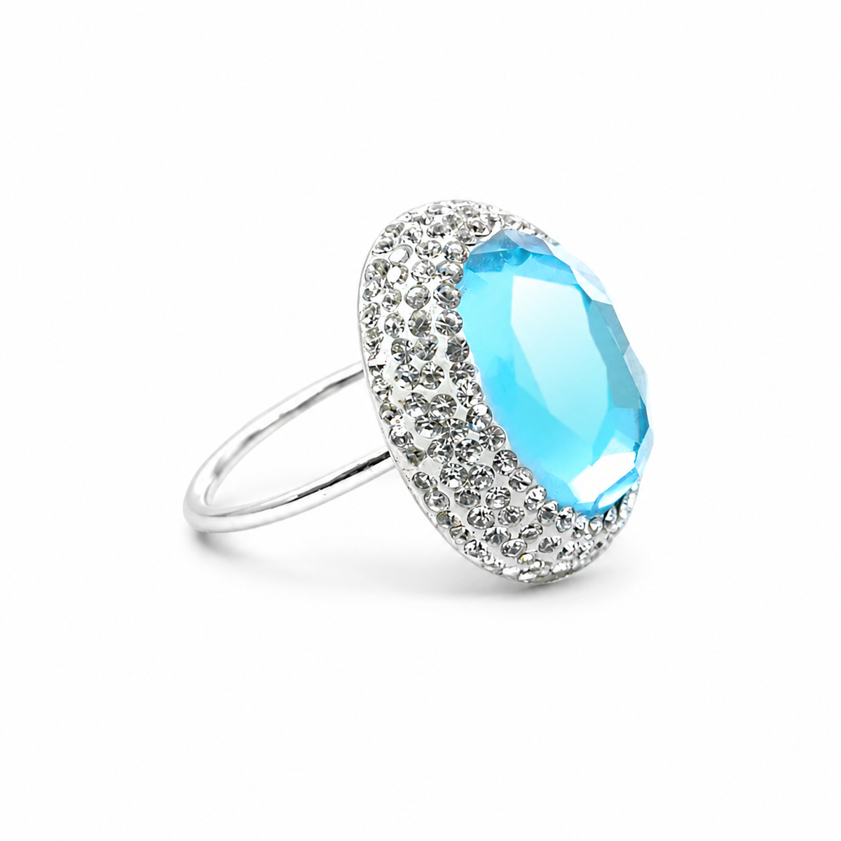 Silver-tone ring with a baby blue round stone and sparkling trim.
