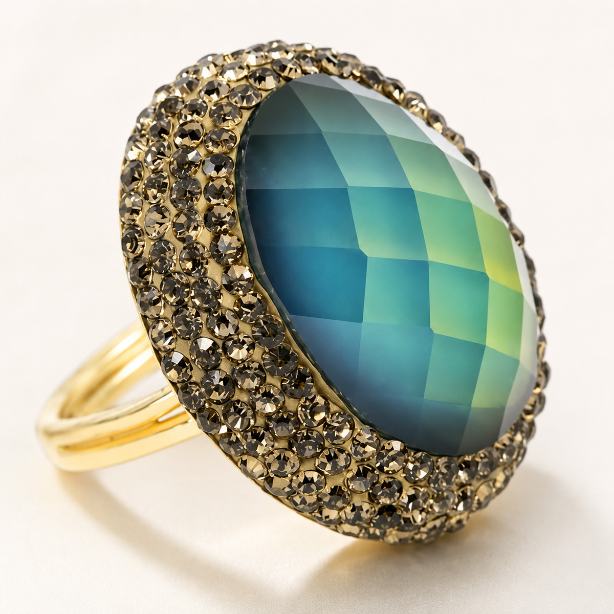 Close-up of a round color-changing ring with a faceted center stone and pavé-style halo.