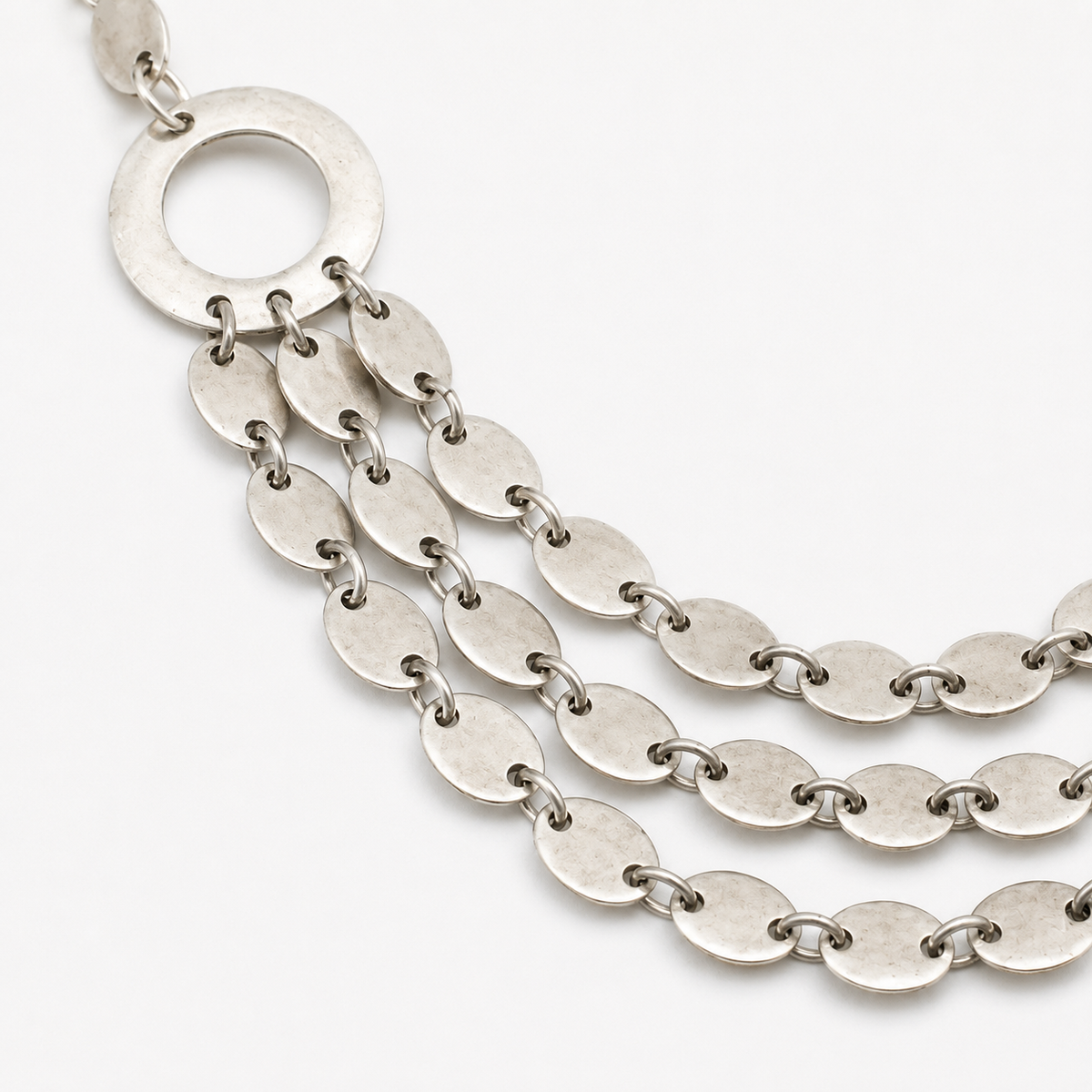 Close view of the oval links and polished silver-tone finish.