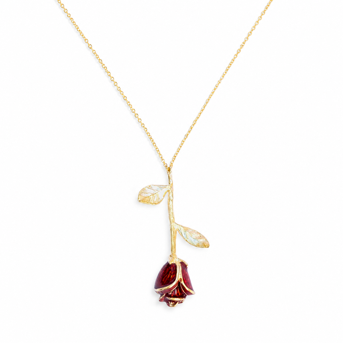 Gold-tone necklace with a red rose pendant and delicate leaf details.