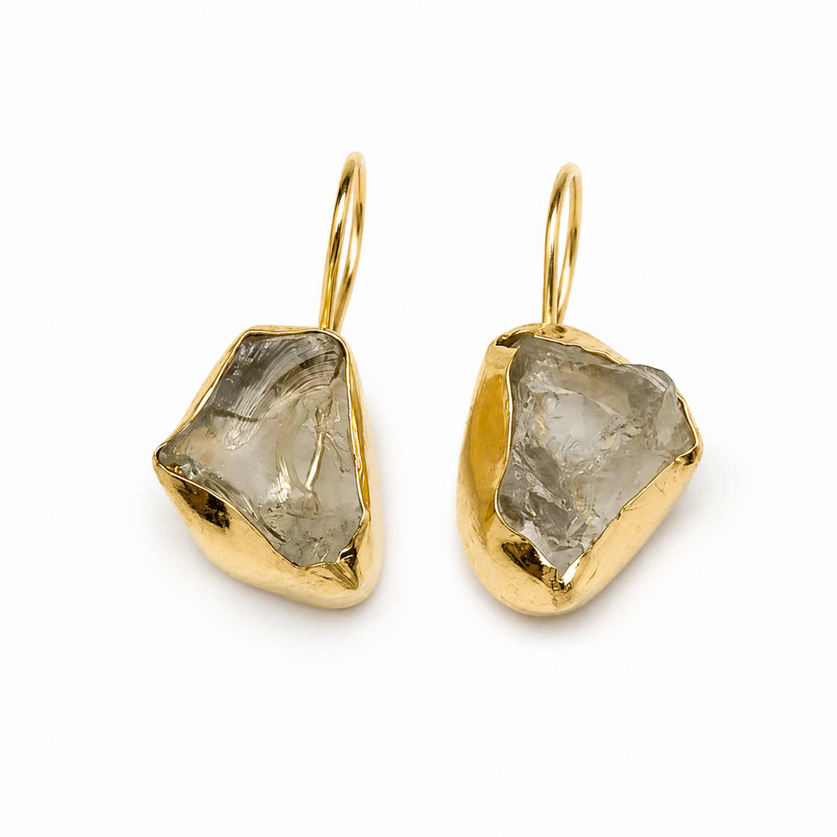 Raw amethyst drop earrings with a gold-plated setting on a white background.