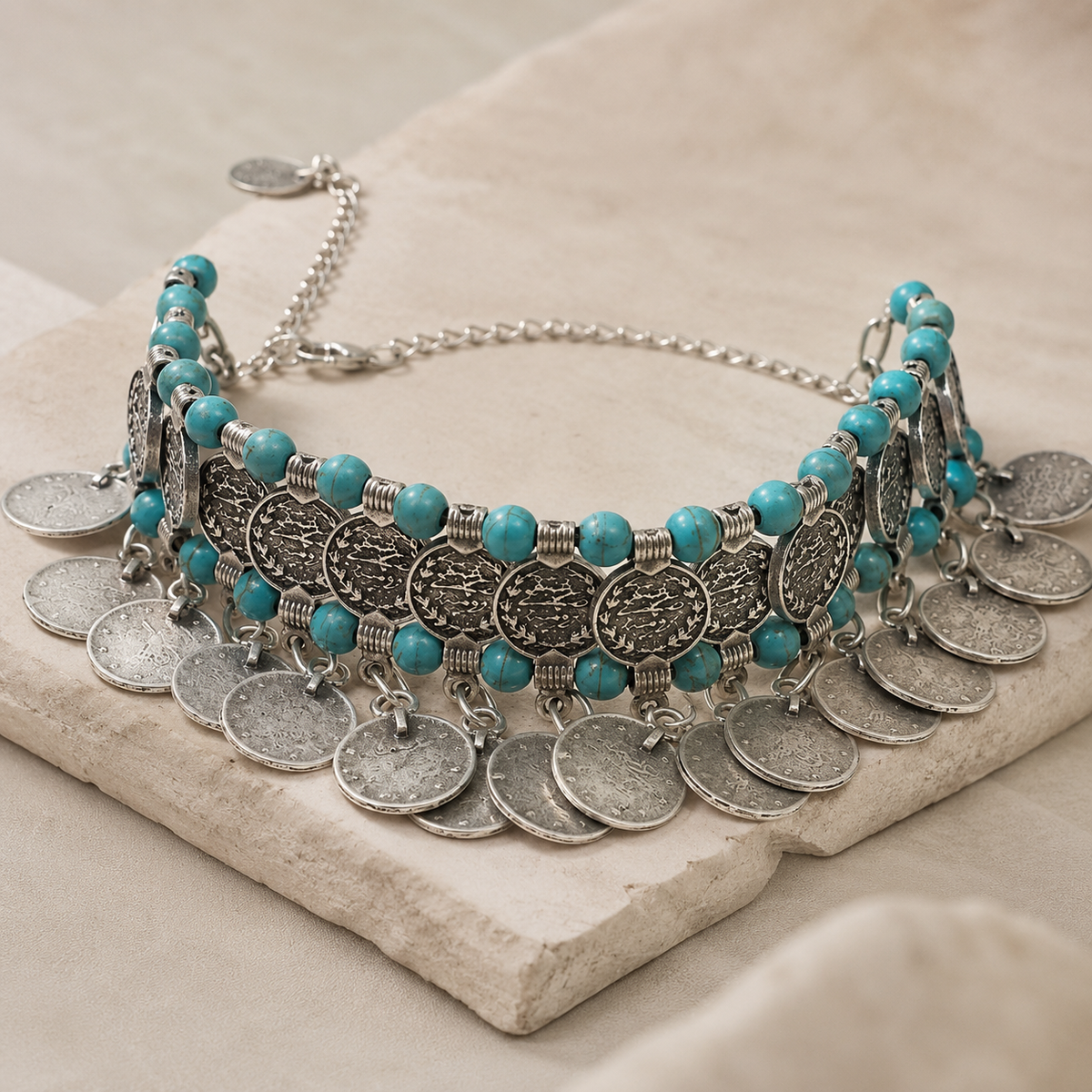 Turquoise and silver-tone fringe necklace shown from the front.