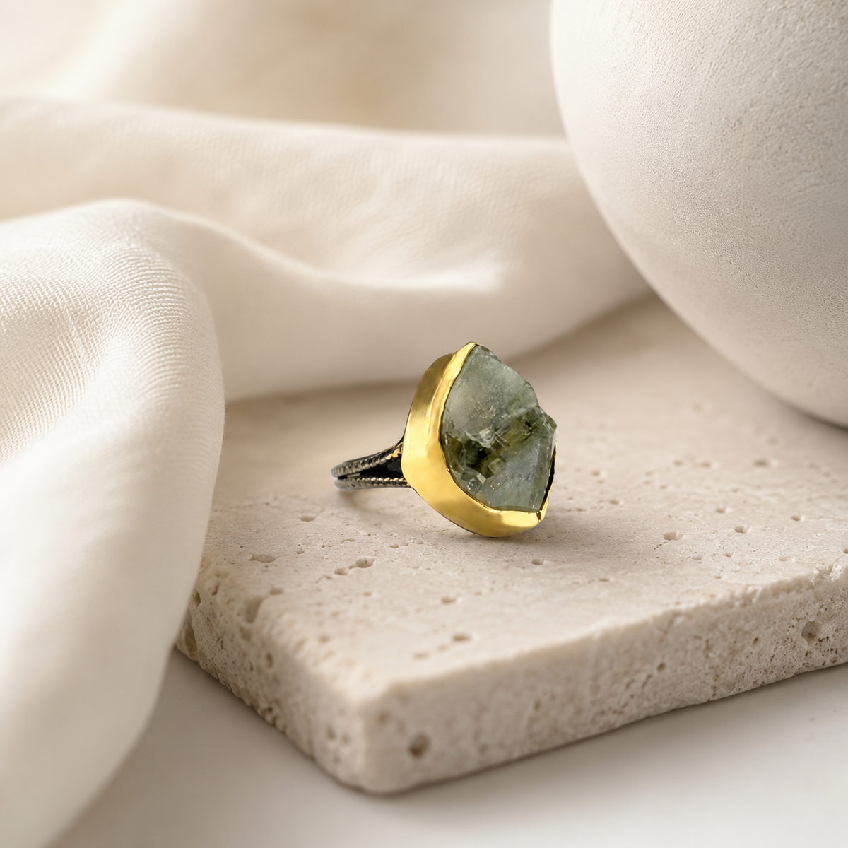 Raw green amethyst statement ring with a gold-plated finish in a clean product view.