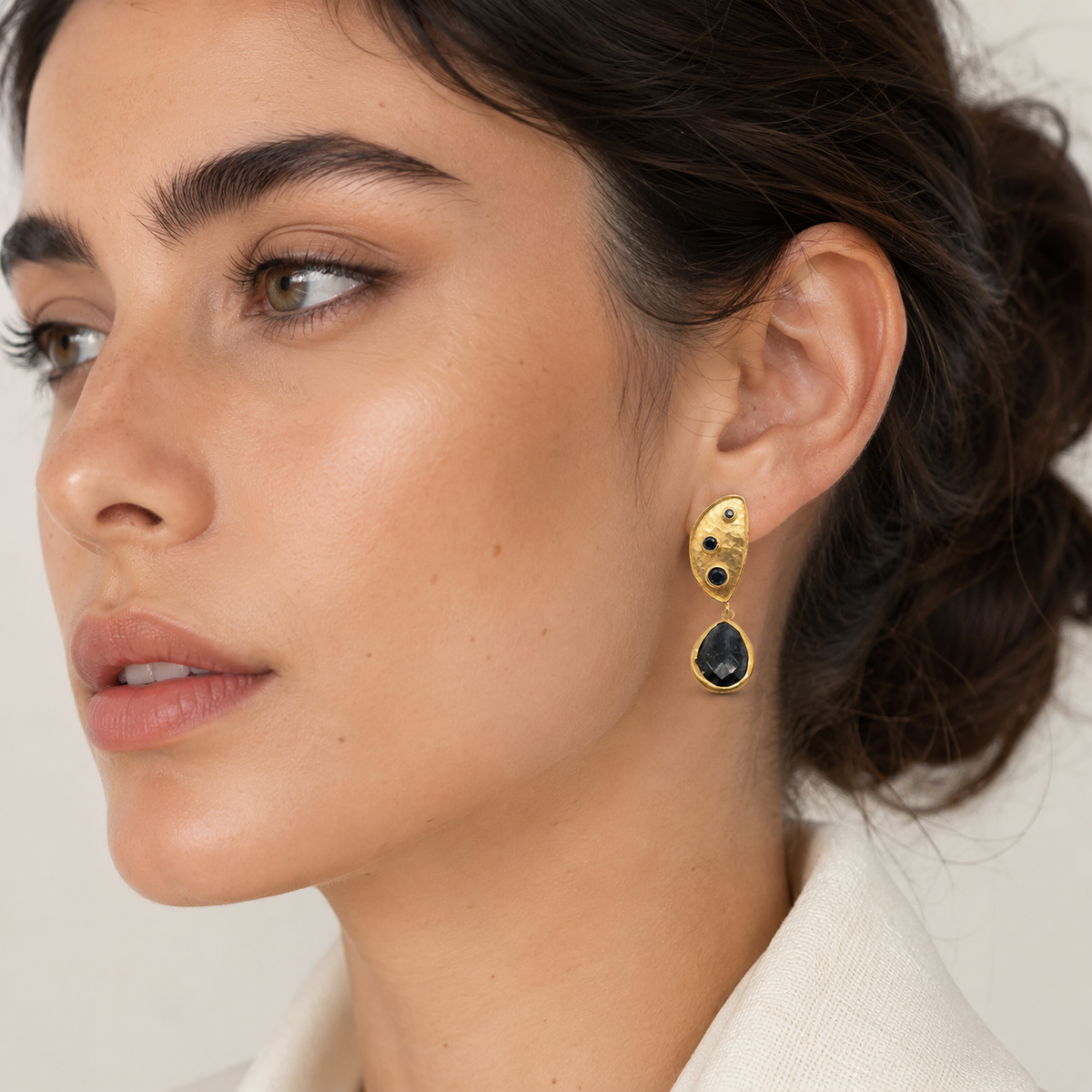 Gold plated half moon dangle earrings shown front view.