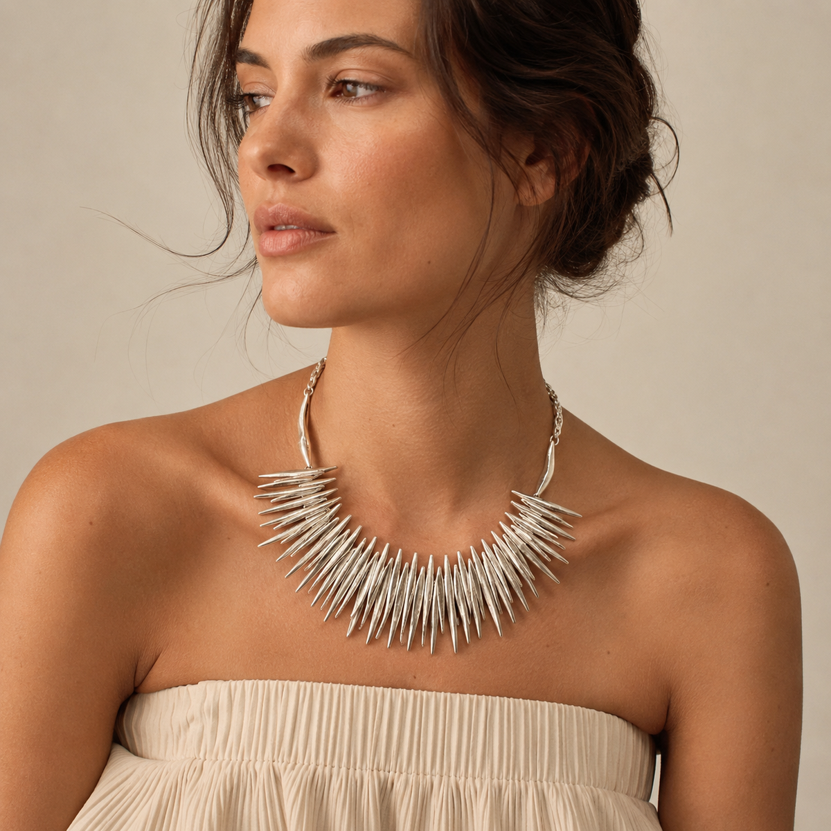 Silver-tone spiky statement necklace with a layered collar design.