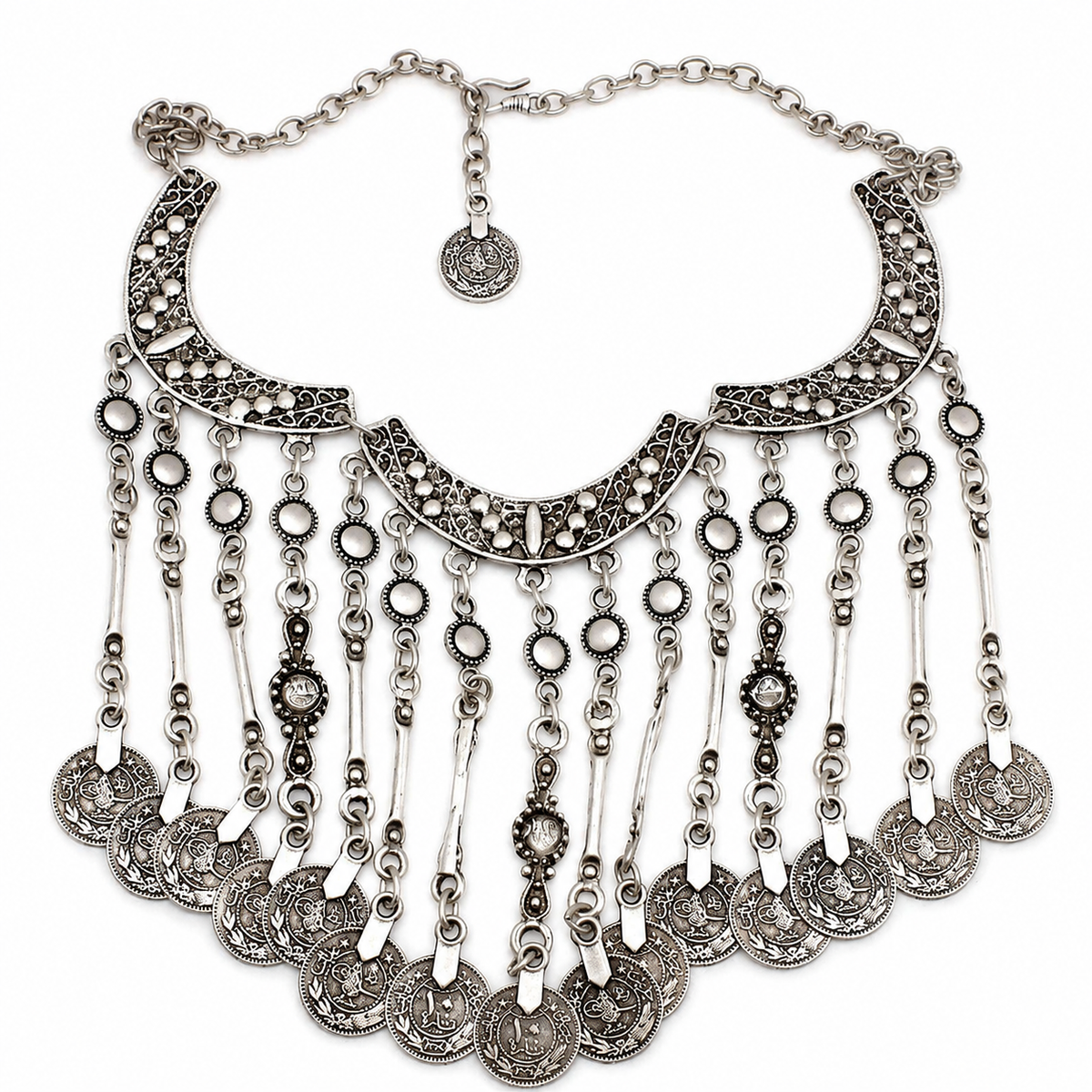 Silver-tone crescent statement necklace with coin fringe and textured details.