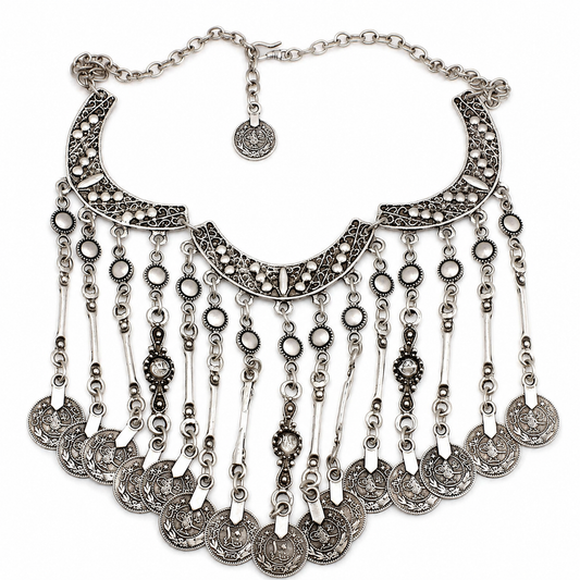 Silver-tone crescent statement necklace with coin fringe and textured details.