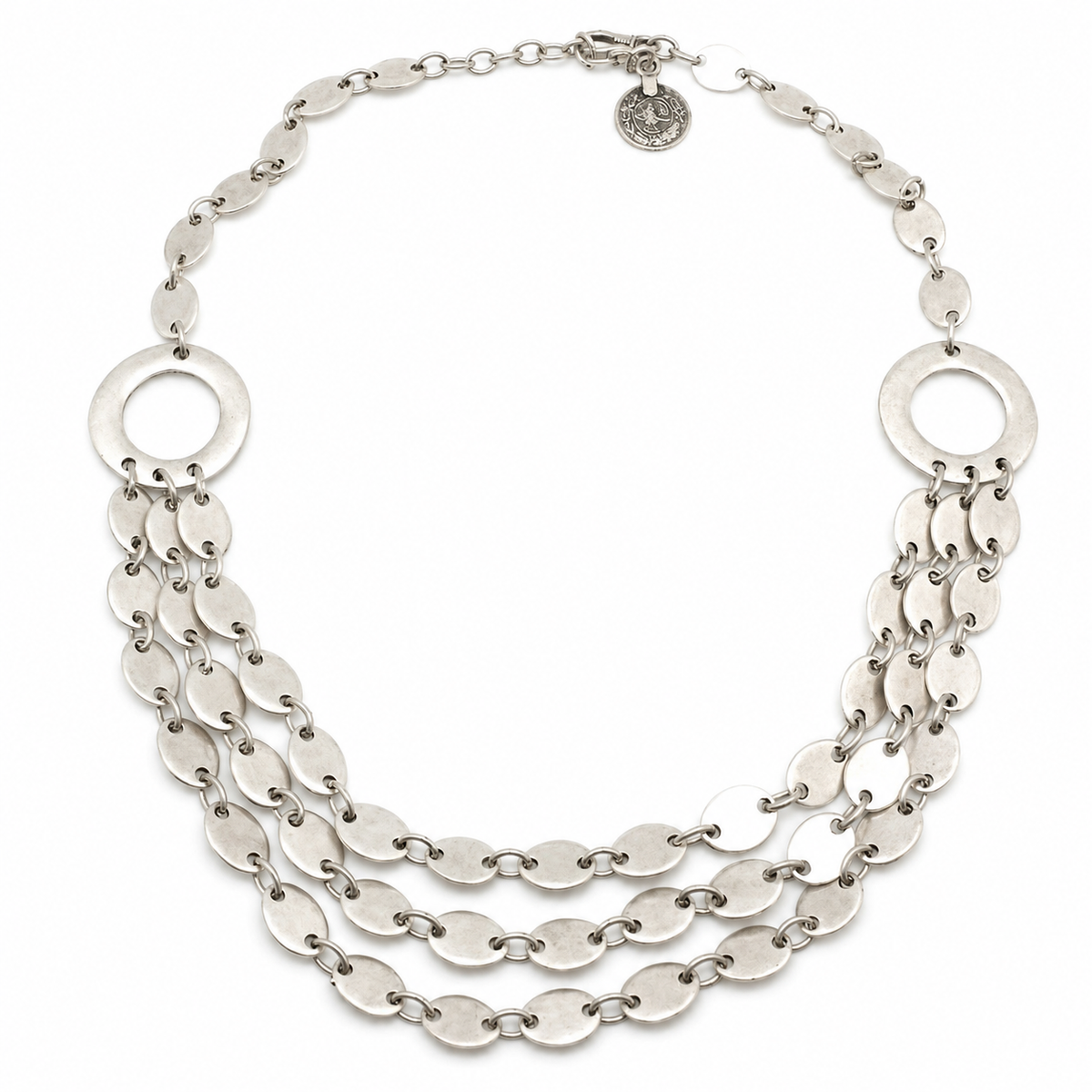 Layered silver-tone necklace with oval links and a sculptural multi-strand design.