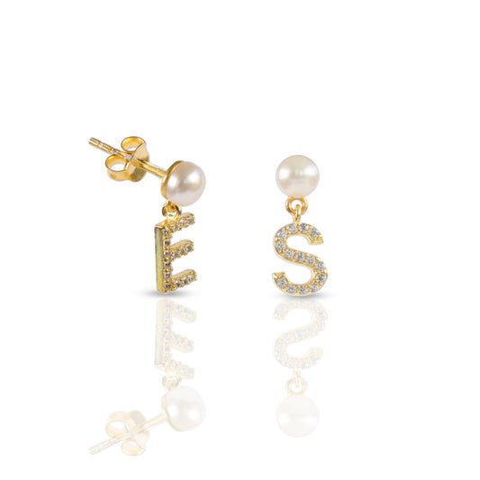 Gold-tone pearl stud earrings with CZ initial dangle charms.