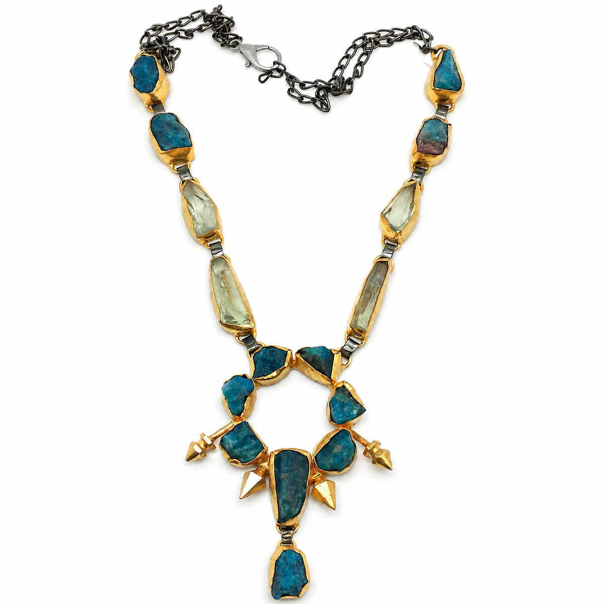 Teal raw stone pendant necklace with gold-tone settings and a dark chain.