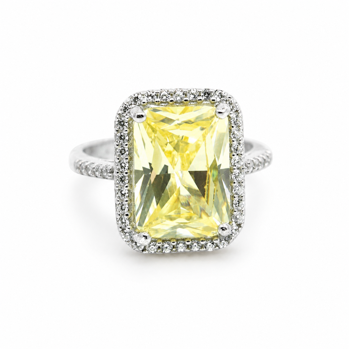 A canary yellow emerald-cut ring with a sparkling silver-tone setting.