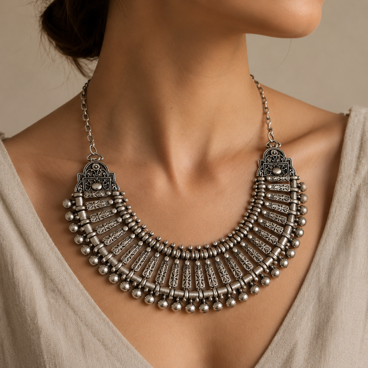 Silver-tone boho fan collar necklace shown from the front with detailed metalwork.