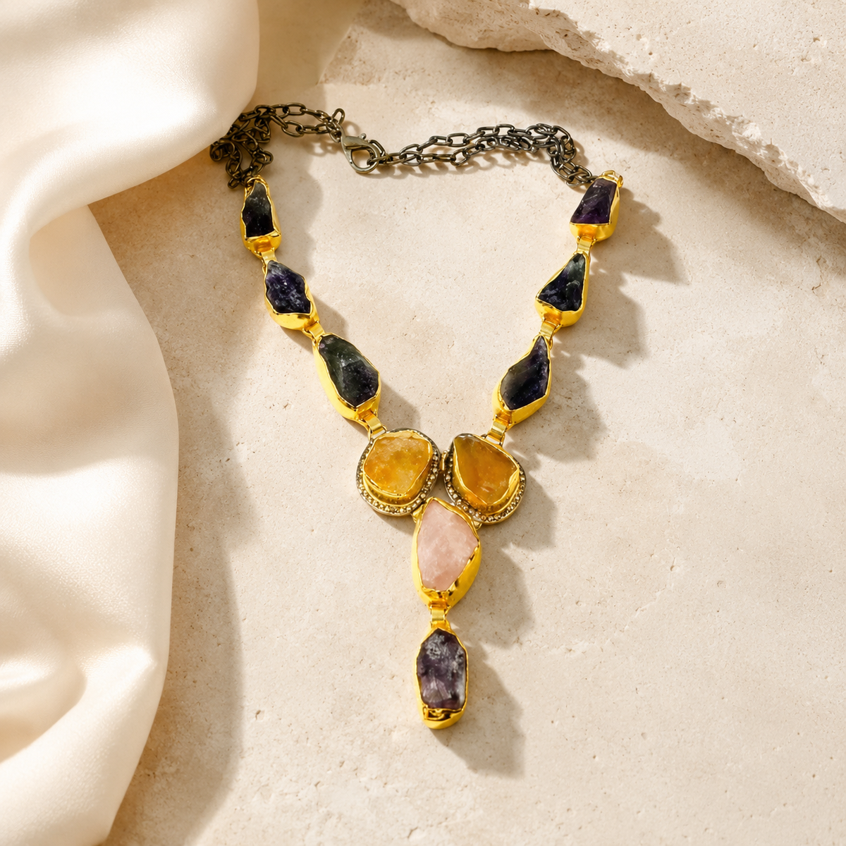 Mixed gemstone Y drop necklace styled for a polished layered look.