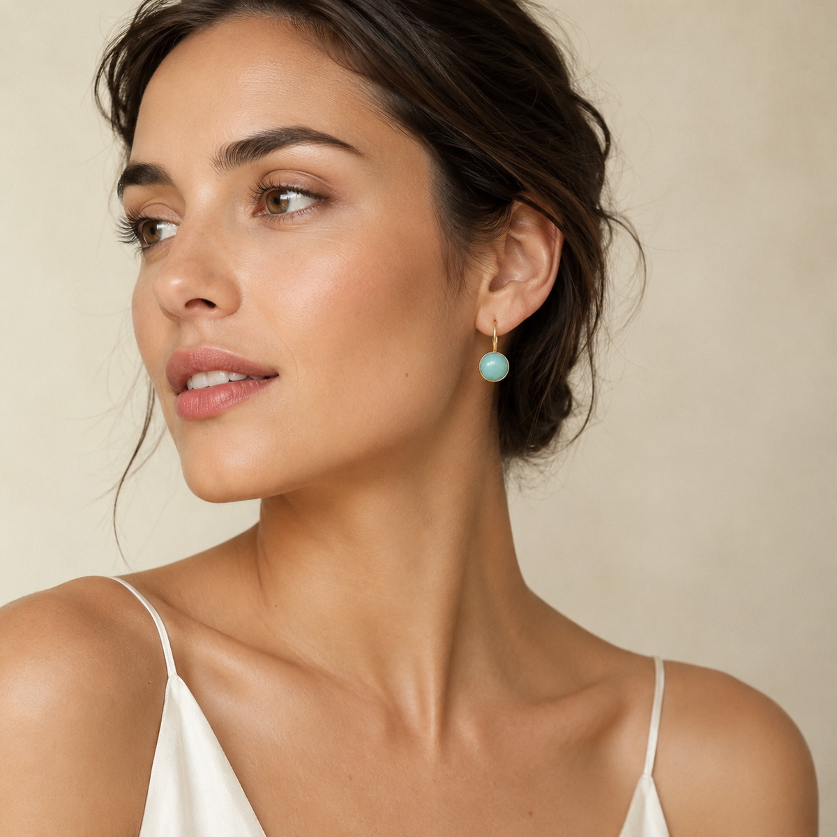 Pair of clear quartz drop earrings shown front on.
