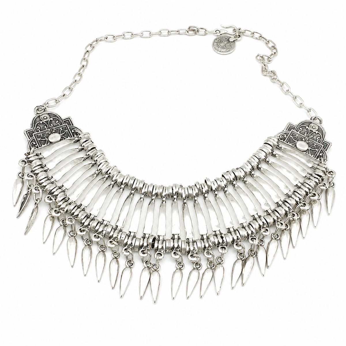 Silver-tone collar necklace with fan-like layers and teardrop dangles on a white background.