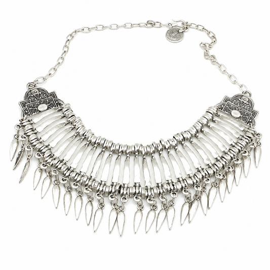 Silver-tone collar necklace with fan-like layers and teardrop dangles on a white background.