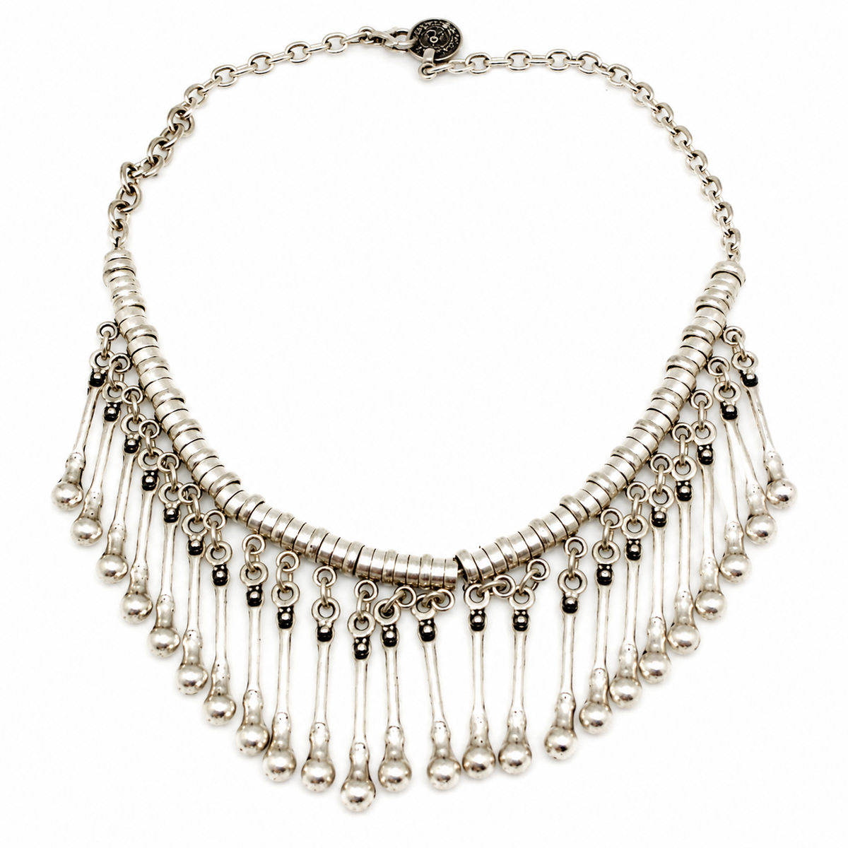 Silver-tone collar necklace with layered drop fringe and a polished finish.