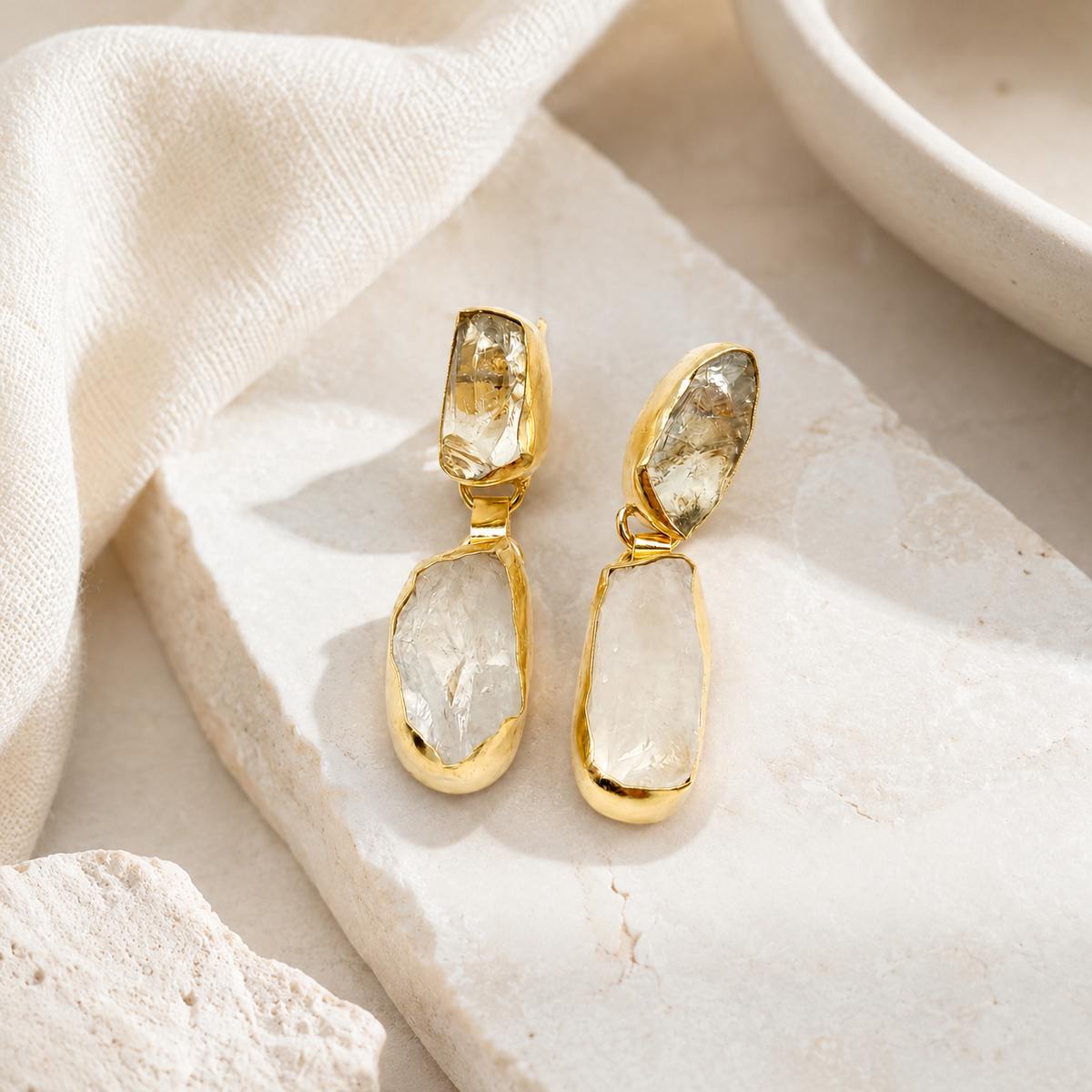 Gold-plated pearl drop earrings with a polished, elegant silhouette.