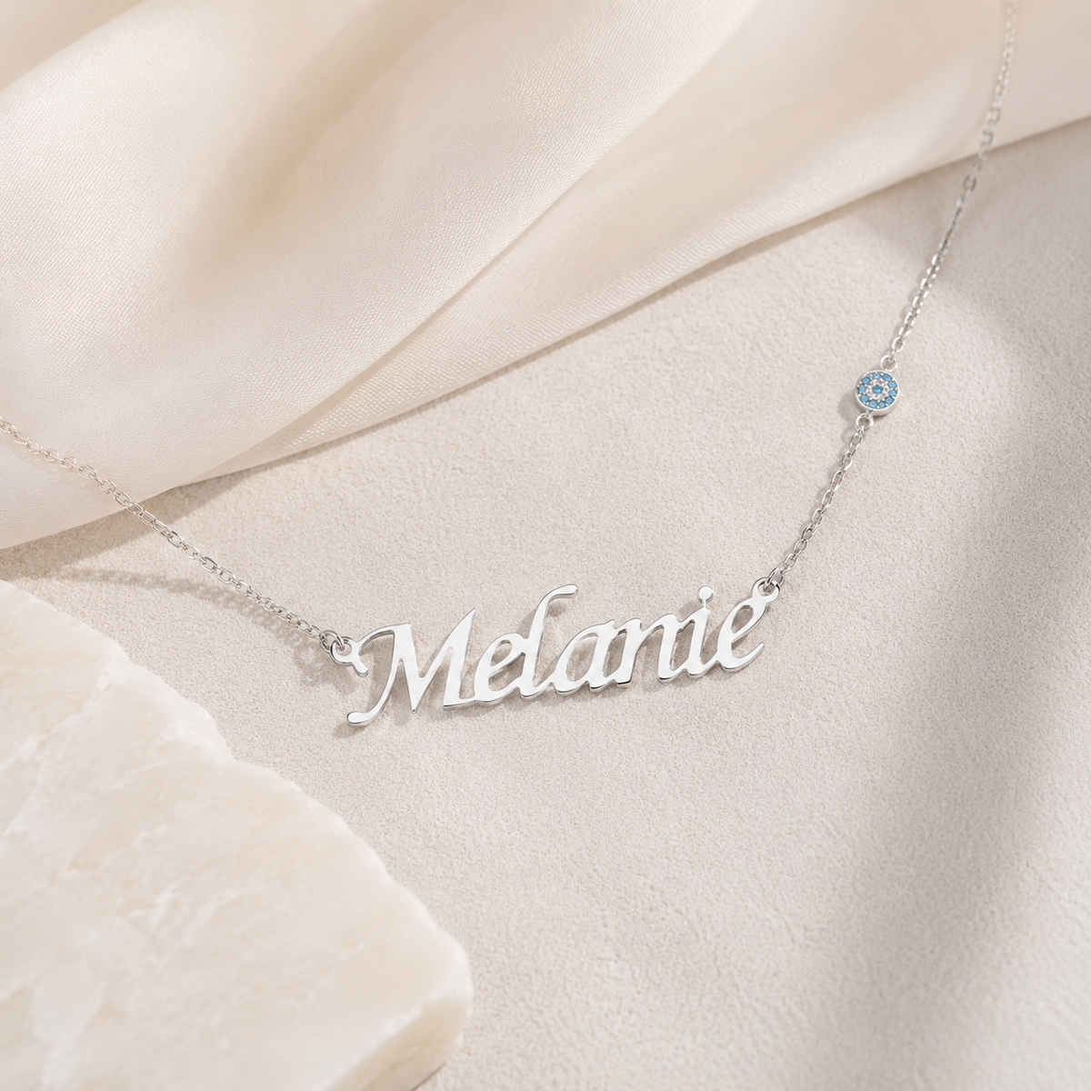 Personalized silver-tone name necklace with a slim chain and polished finish.