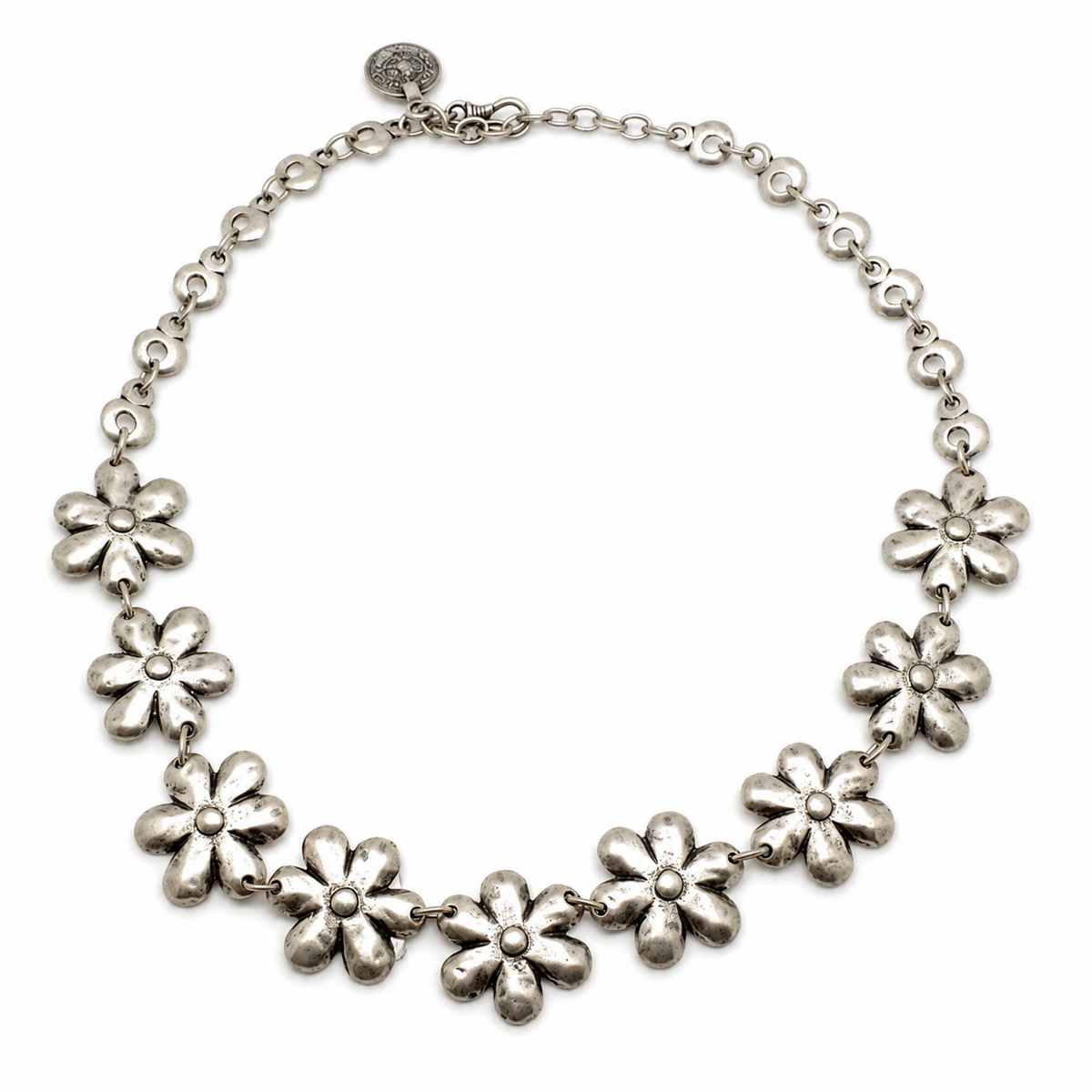 Silver-tone necklace with flower-shaped links arranged in a curved silhouette.