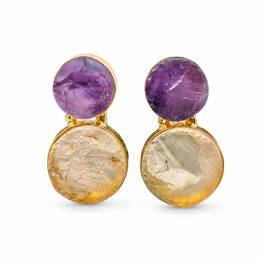 Pair of drop earrings with rough purple amethyst and clear quartz set in a gold-plated frame.