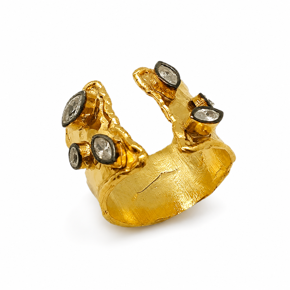 Gold-plated open cuff ring with clear quartz accents and a sculptural textured shape.