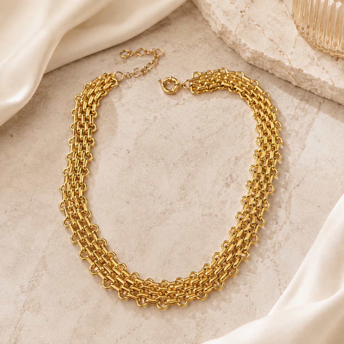 Gold-plated brass statement necklace with layered flat chain links.