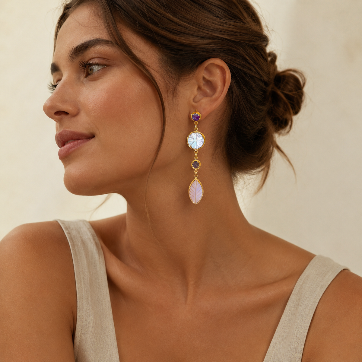 Gold-plated drop earrings with mother of pearl and rose quartz-style stones.