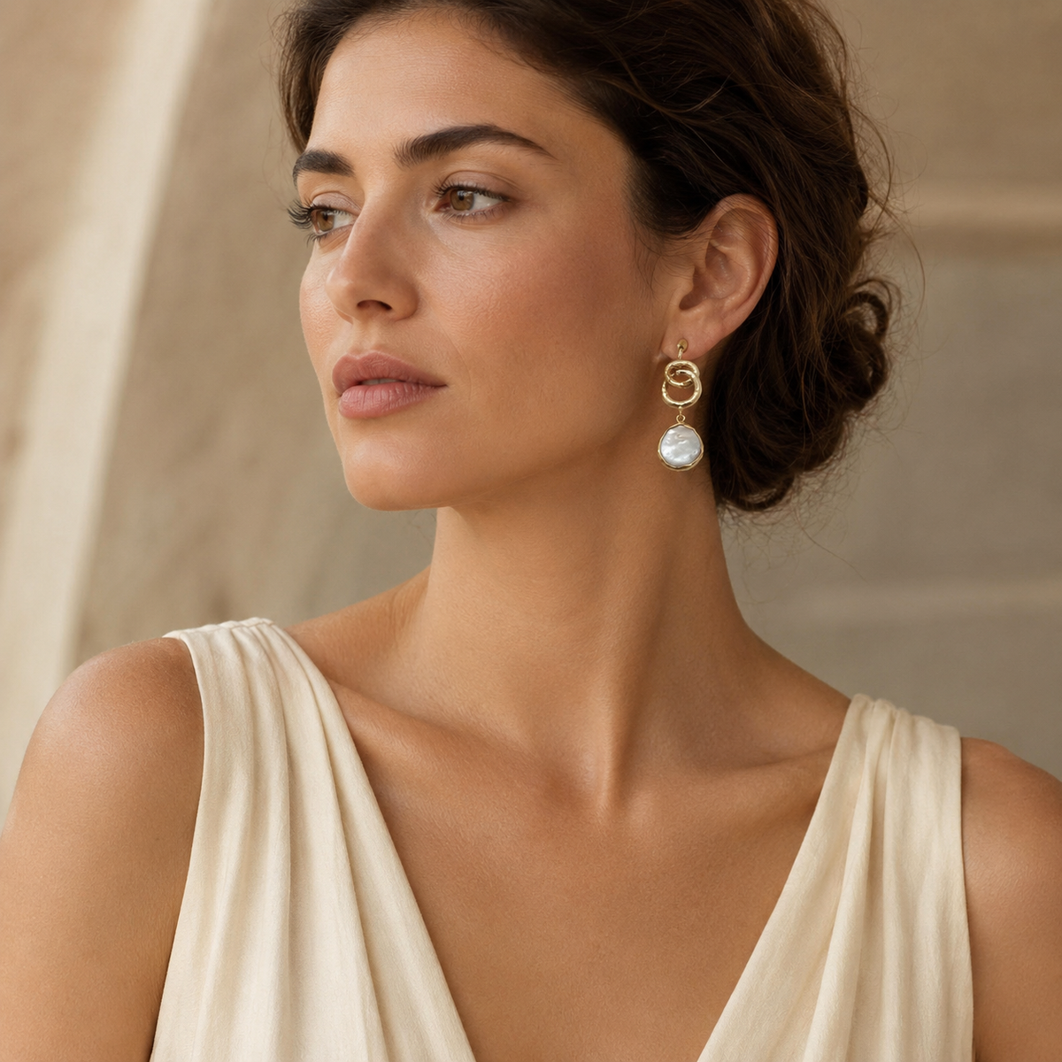 Gold plated earrings with textured links and soft pearl-like drops.
